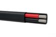 Close-up of black flat twin sheath 8 B&S marine battery cable with red and black cores and tinned copper conductors